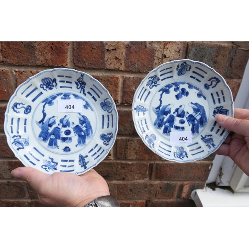 404 - Three Chinese blue and white saucer dishes, Kangxi (1662-1722), each decorated with a central rounde... 