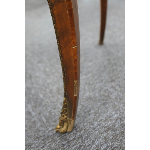 923 - Victorian walnut table in the French style by Howard & Sons, circa 1880, the shaped rectangular top ... 