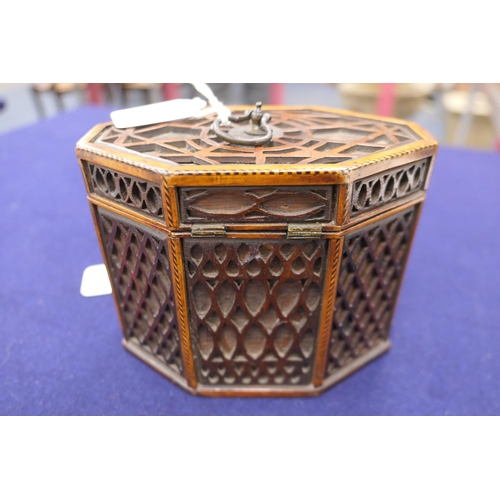 823 - George III mahogany blind fretwork tea caddy, of octagonal form, width 16cm, height 13cm