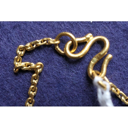 91 - Eastern yellow metal chain link necklace, testing as 22ct, length  62cm, weight approx. 22g