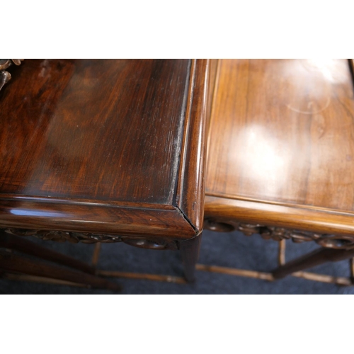 914 - Chinese nest of carved rosewood tables, circa 1900, each having a prunus blossom carved frieze on si... 