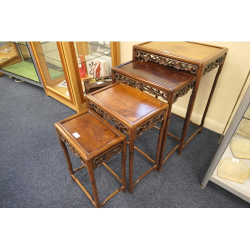 914 - Chinese nest of carved rosewood tables, circa 1900, each having a prunus blossom carved frieze on si... 