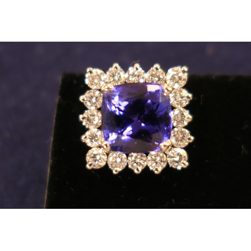 51 - Suite of tanzanite and diamond jewellery comprising pendant necklace, the pendant centred with a cus... 