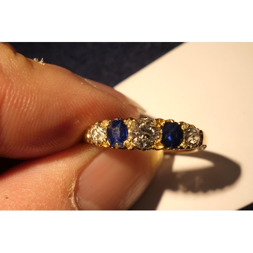 172 - Sapphire and diamond five stone ring in 18ct yellow gold, the central old round cut diamond of appro... 