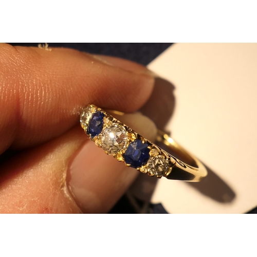 172 - Sapphire and diamond five stone ring in 18ct yellow gold, the central old round cut diamond of appro... 