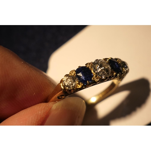 172 - Sapphire and diamond five stone ring in 18ct yellow gold, the central old round cut diamond of appro... 