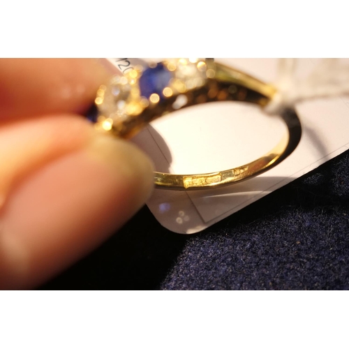 172 - Sapphire and diamond five stone ring in 18ct yellow gold, the central old round cut diamond of appro... 