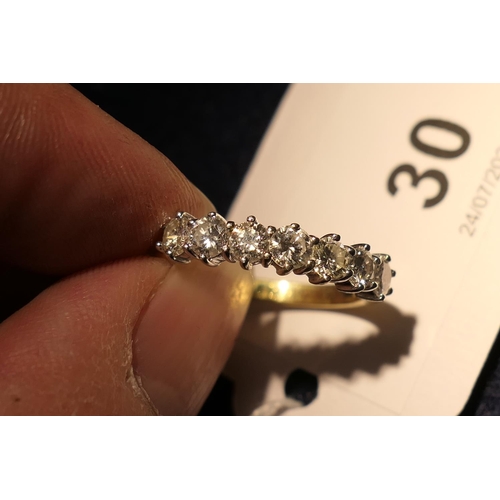 30 - Diamond seven stone ring, well matched brilliant cut stones estimated as K/L colour and SI clarity, ... 