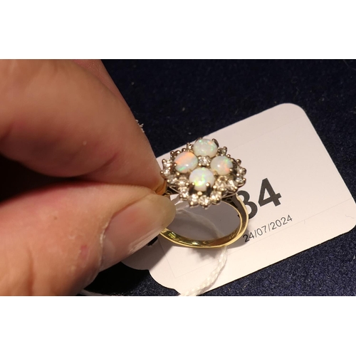 34 - Opal and diamond cluster ring, set with four cabochon round opals, centred and bordered with small b... 