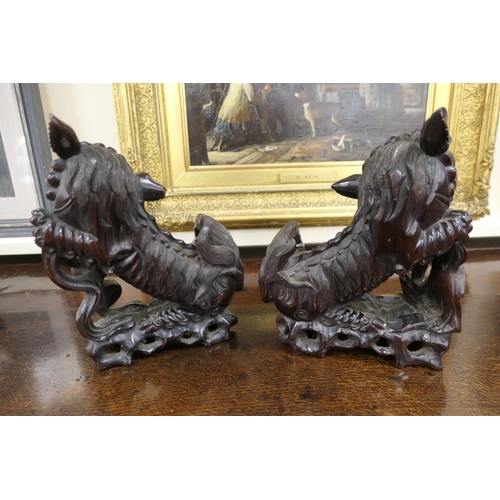 835 - Pair of Chinese carved hardwood Dogs of Fo, late 19th/early 20th Century, with original glass eyes, ... 