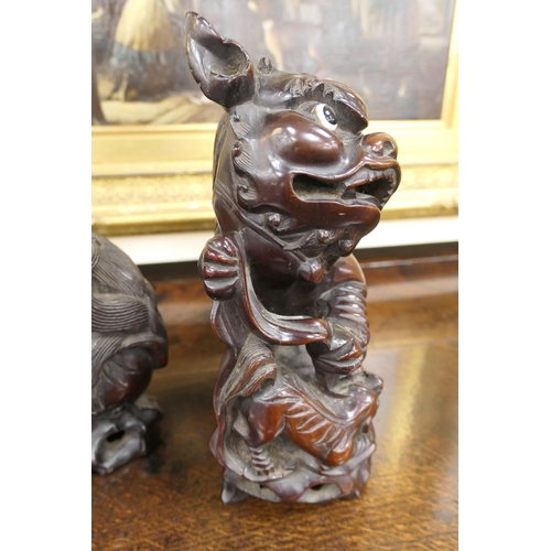 835 - Pair of Chinese carved hardwood Dogs of Fo, late 19th/early 20th Century, with original glass eyes, ... 