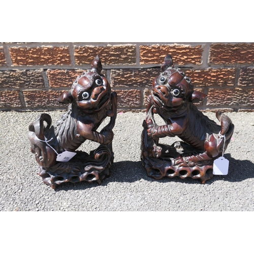 835 - Pair of Chinese carved hardwood Dogs of Fo, late 19th/early 20th Century, with original glass eyes, ... 