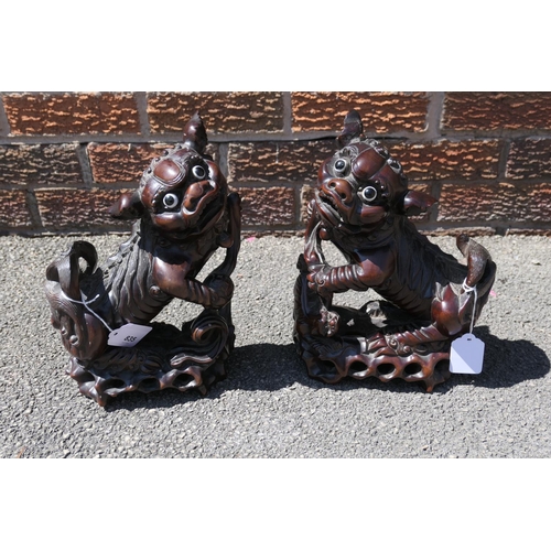 835 - Pair of Chinese carved hardwood Dogs of Fo, late 19th/early 20th Century, with original glass eyes, ... 