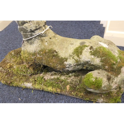 965 - Pair of weather reconstituted stone recumbent hound garden ornaments, length 67cm, height 42cm