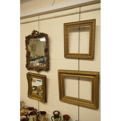 38 - Two decorative gilt framed wall mirrors and two gilt moulded picture frames (4)