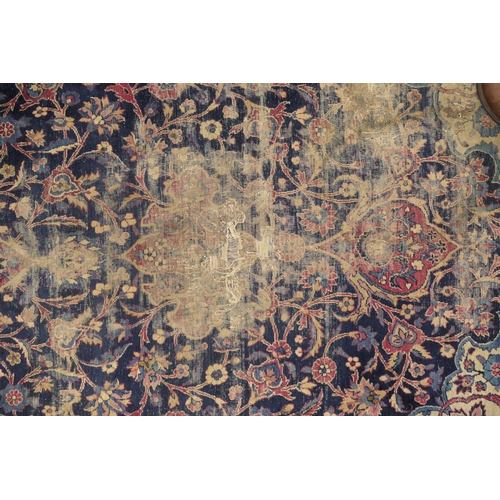 562 - Persian woollen rug late 19th Century (extensively worn), size 420cm x 180cm