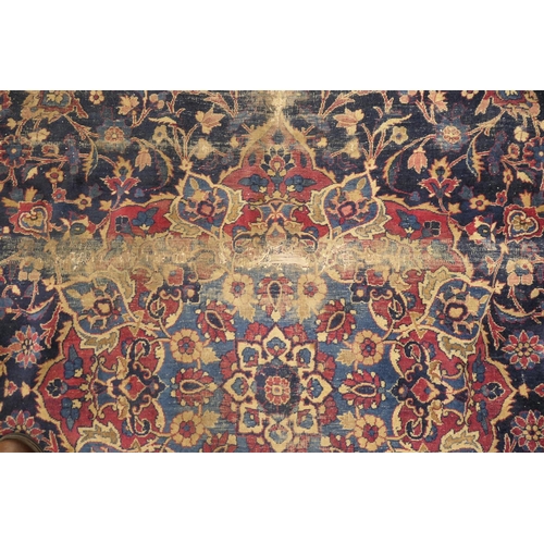 562 - Persian woollen rug late 19th Century (extensively worn), size 420cm x 180cm