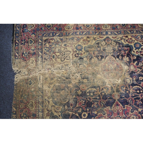 562 - Persian woollen rug late 19th Century (extensively worn), size 420cm x 180cm