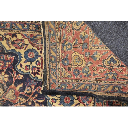 562 - Persian woollen rug late 19th Century (extensively worn), size 420cm x 180cm