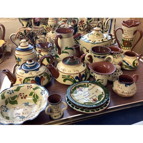 46 - Quantity of Torquay slip decorated pottery including Motto wares, small Crown Dorset bottle vase, pu... 