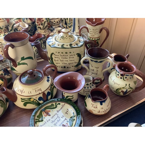 46 - Quantity of Torquay slip decorated pottery including Motto wares, small Crown Dorset bottle vase, pu... 