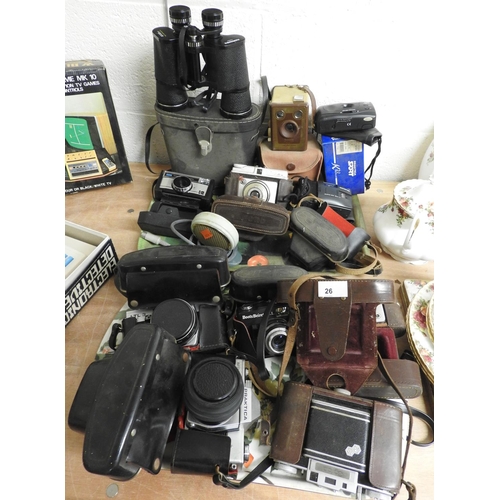 26 - Assorted vintage cameras including Practika, Ilford, and a pair of Hanimex 10x50 binoculars