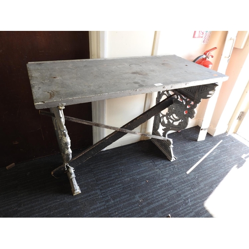 597 - Victorian cast iron table ends, with a later slate top, width 99cm, depth 49cm