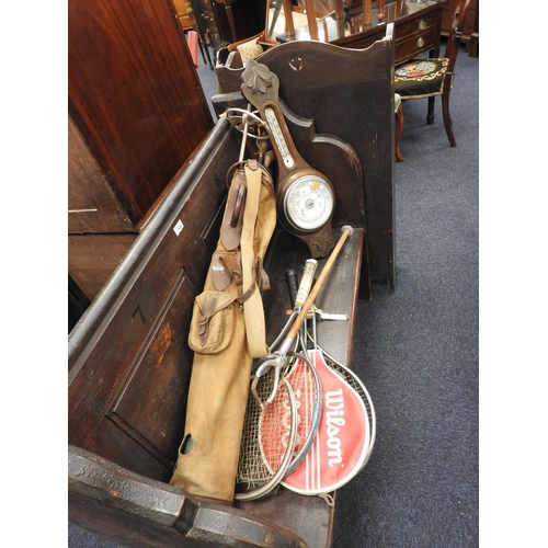 631 - Vintage golf clubs, shooting stick, ski pole, tennis racquets and an aneroid barometer