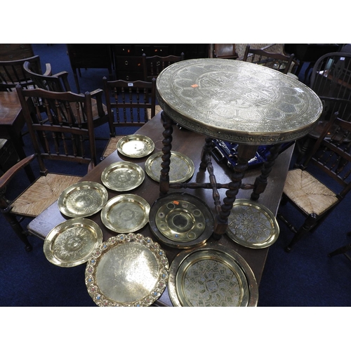 642 - Brass topped folding barleytwist table, also a number of copper and brass trays, some with silver li... 