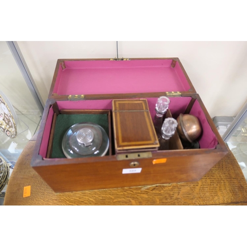 589 - Mahogany tea caddy, the interior adapted and enclosing oil and vinegar bottles and an inkwell, centr... 