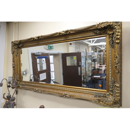 598 - Large moulded gilt framed bevelled glass wall mirror in Victorian style, width 176cm, height 90cm