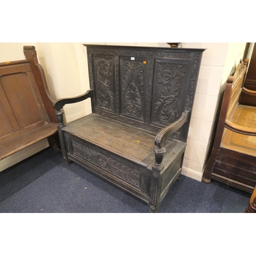 614 - Victorian carved oak box settle, width 120cm, depth 53cm, height 126cm