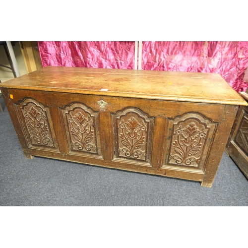 629 - 18th Century carved oak four panel coffer, width 138cm, height 59cm