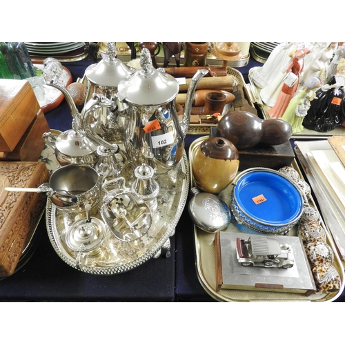 102 - Modern silver plated tea service presented on an oval serving tray, other plated ware, cowrie shell ... 