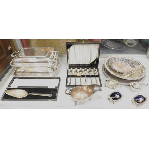 229 - Assortment of silver plated ware including two lidded entree dishes, four piece condiment set, cased... 