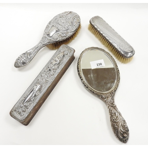 230 - Silver backed hand mirror, silver backed hairbrush (both worn), silver backed clothes brush, silver ... 