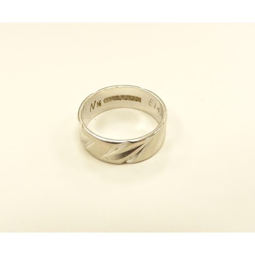 271 - 18ct white gold wedding ring, with chiselled detail, size N, weight approx. 5g