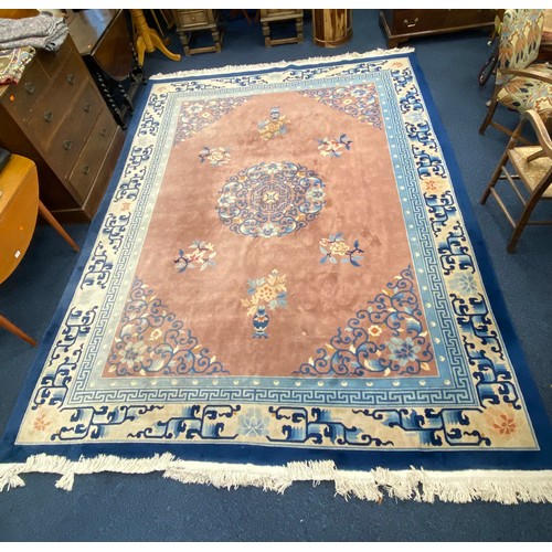 605 - Traditional Chinese pink ground woollen carpet, 380cm x 275cm