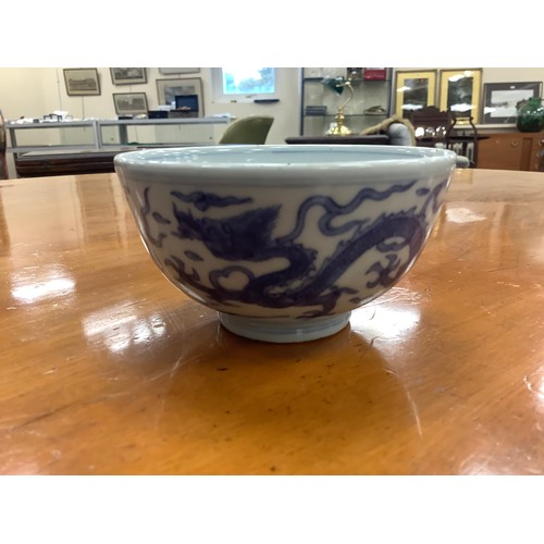 143 - Chinese blue and white dragon bowl with Ming six character mark but 20th Century, 10cm diameter