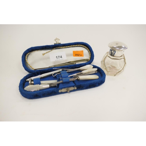 174 - Cased mother of pearl manicure set and a silver mounted moulded glass scent bottle (2)