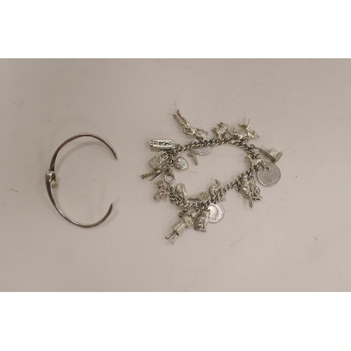 193 - Silver charm bracelet, gross weight approx. 57g, also an unmarked silver torc bangle, weight approx.... 