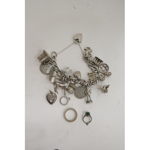 205 - Silver curb link charm bracelet, with a number of sterling silver and other white metal charms, also... 