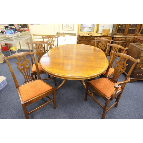 295 - Quality oak extending dining table together with six (4+2) Chippendale style oak dining chairs, by C... 