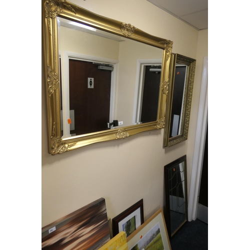 397 - Gilt swept frame wall mirror, 105cm x 74cm, also another gilt framed moulded gilt framed wall mirror... 