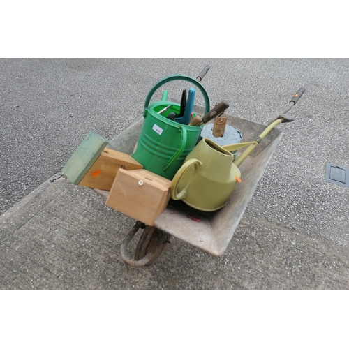 415 - Garden wheelbarrow, gardening tools including watering cans, bird boxes etc