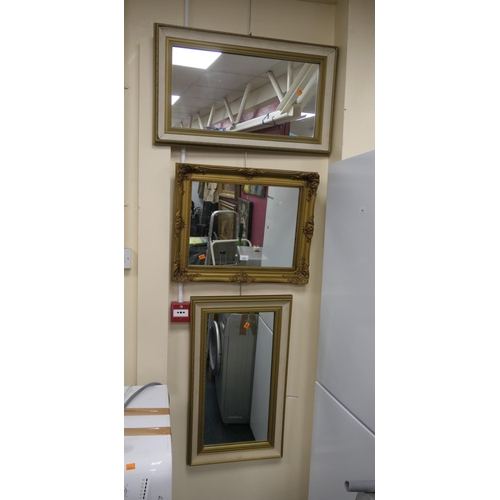 423 - Gilt swept frame wall mirror and two further wall mirrors (3)