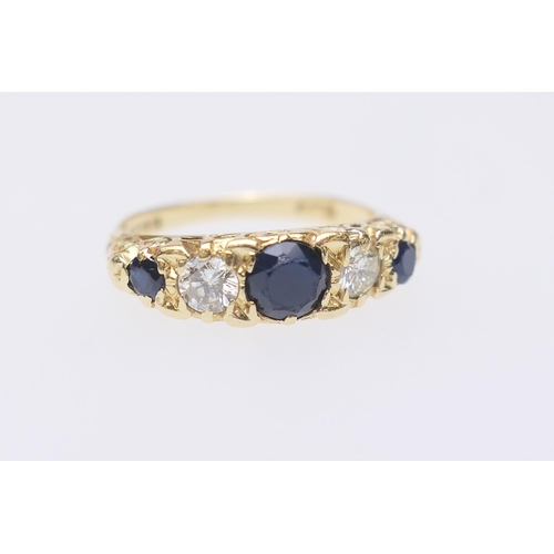 108 - Sapphire and diamond five stone ring, centred with a round cut sapphire of approx. 0.5ct, flanked by... 