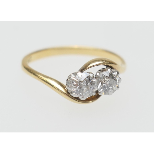 113 - Diamond two stone crossover ring, set with two old round cut diamonds totalling approx. 0.5ct, colou... 