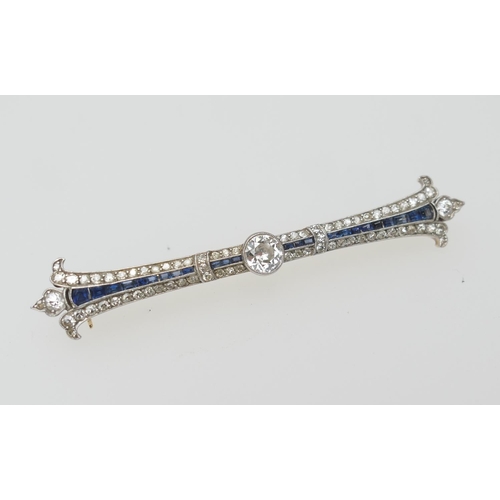 123 - Edwardian diamond and sapphire brooch, circa 1910, centred with an old round cut diamond of approx. ... 