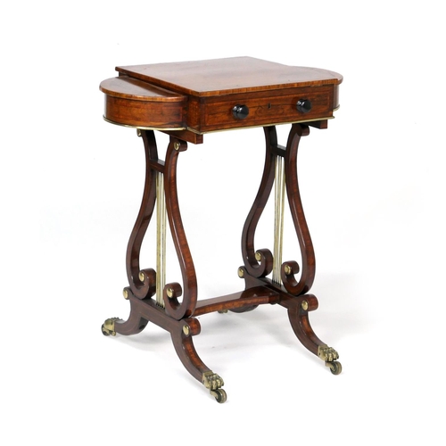 523 - Quality Regency rosewood work table, the satinwood banded lift up lectern top flanked on either side... 